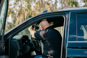Advance Auto Glass technician installing windshield for local Columbia driver